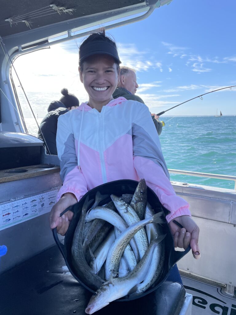 Whiting In Bucket With Lady